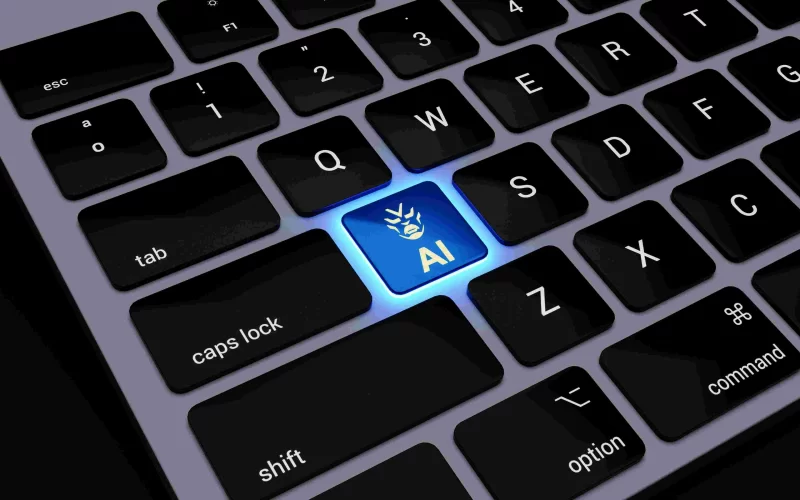 Laptop keyboard with glowing blue AI key